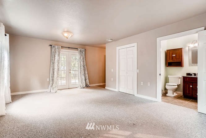832 Southwest 4th Place Renton, WA 98057 - Photo 14 of 25 a view of empty room with a window and a bathroom