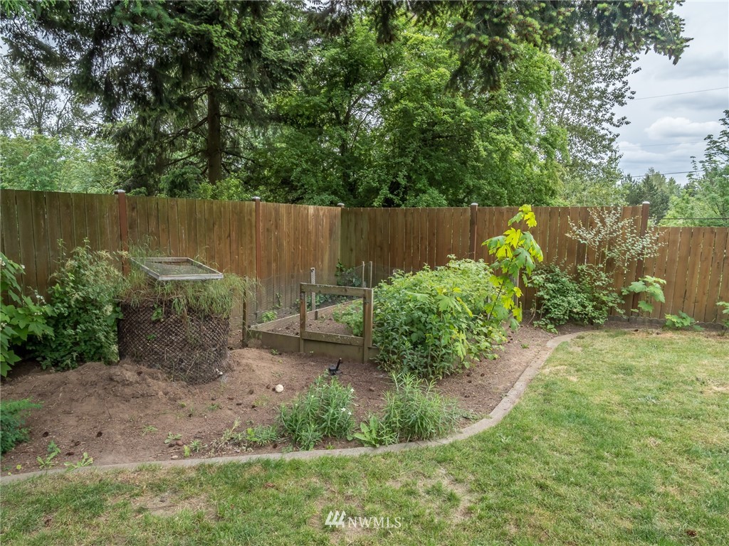 832 Southwest 4th Place Renton, WA 98057 - Photo 21 of 25 a garden with plants and wooden fence