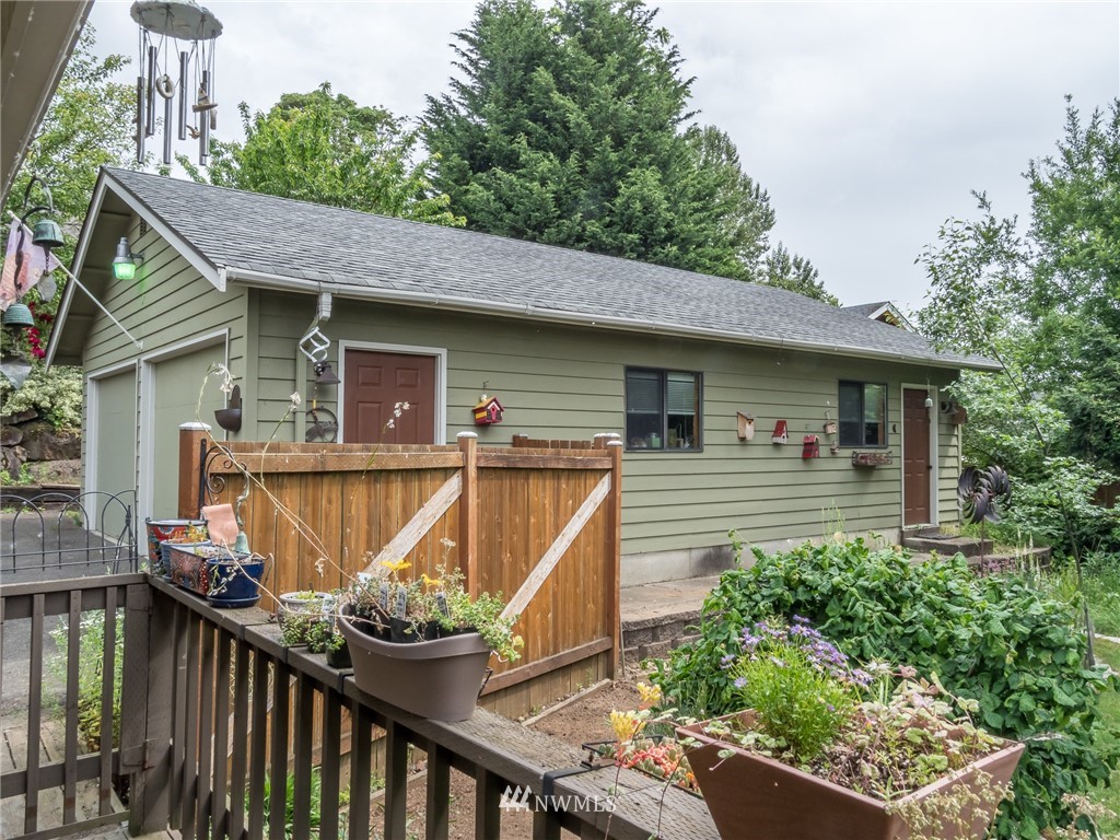 832 Southwest 4th Place Renton, WA 98057 - Photo 23 of 25 a front view of a house with wooden deck and furniture