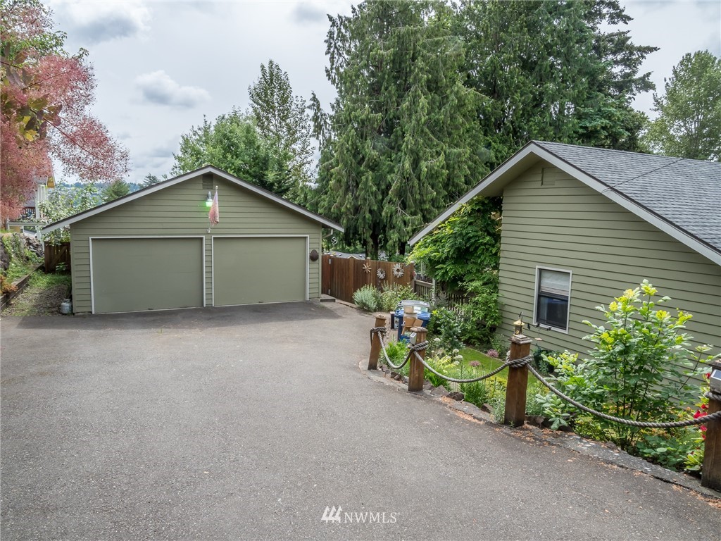 832 Southwest 4th Place Renton, WA 98057 - Photo 24 of 25 a view of a house with a yard and garage