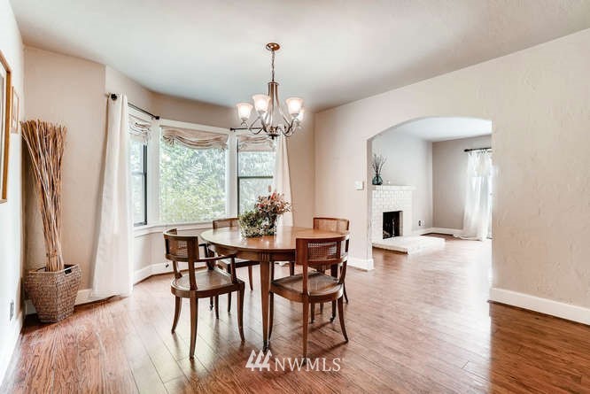 832 Southwest 4th Place Renton, WA 98057 - Photo 6 of 25 a view of a dining room with furniture window and wooden floor