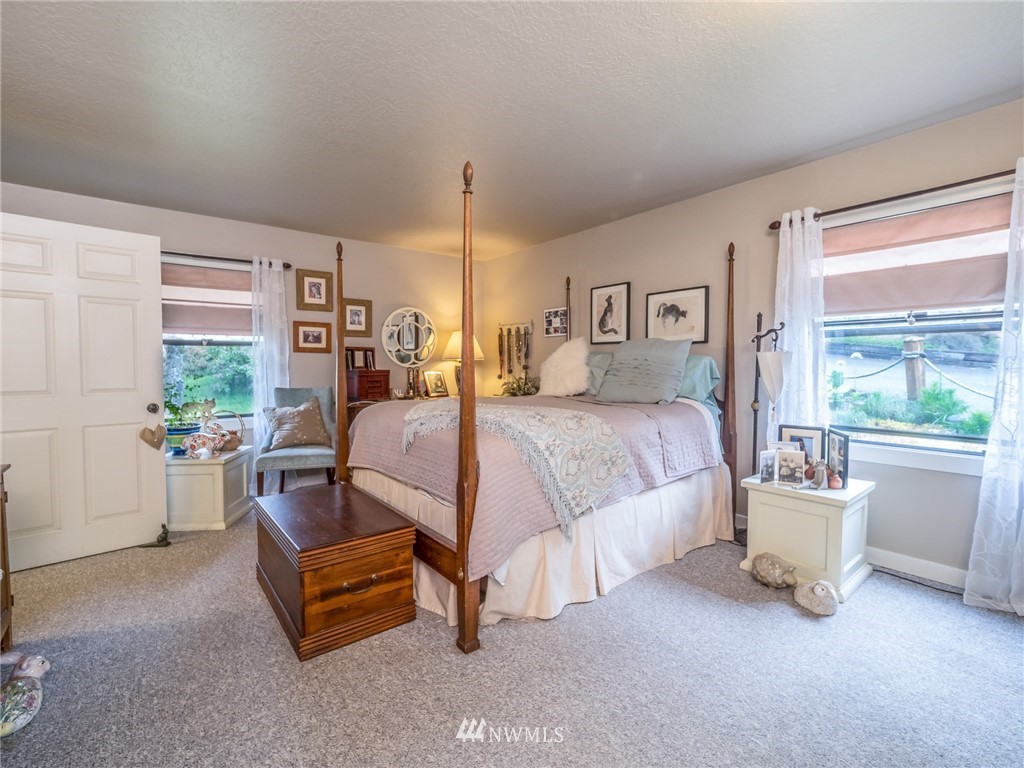 832 Southwest 4th Place Renton, WA 98057 - Photo 9 of 25 a bedroom with a bed and a table