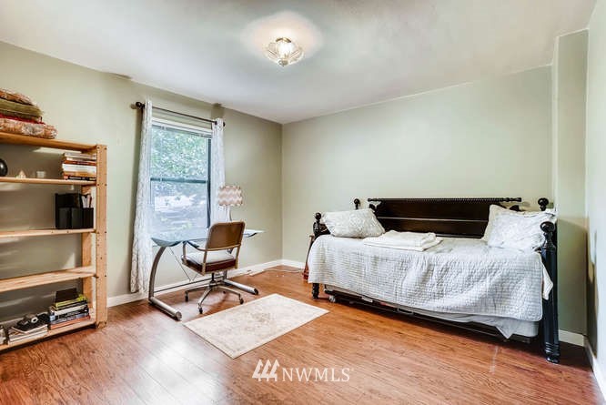 832 Southwest 4th Place Renton, WA 98057 - Photo 10 of 25 a bedroom with a bed a desk and chair with wooden floor