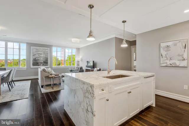 a stove top oven sitting inside of a kitchen