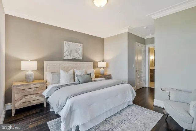 a bedroom with a large bed and a large window