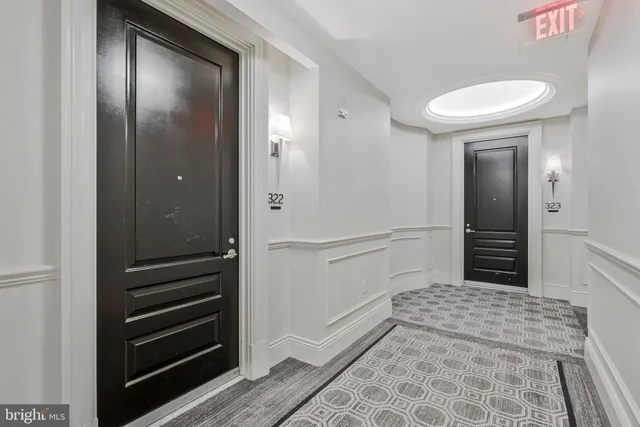 a view of living room with furniture and wooden floor