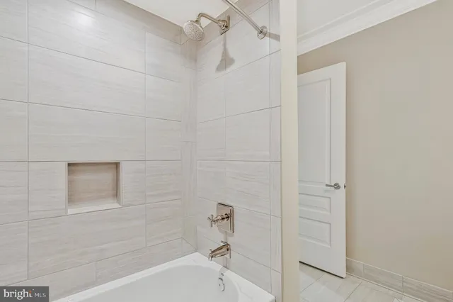 a view of a hallway with washer and dryer