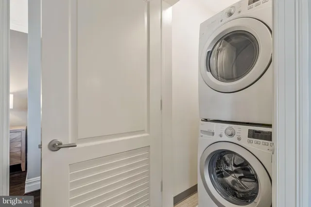 a view of a swimming pool with a lounge chairs in patio