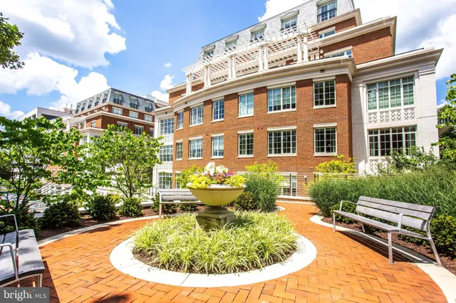 a living room with furniture a table and chairs