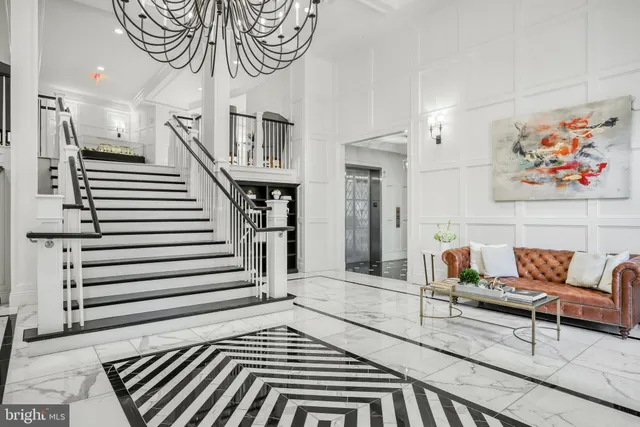 a view of patio with couches and a fire pit