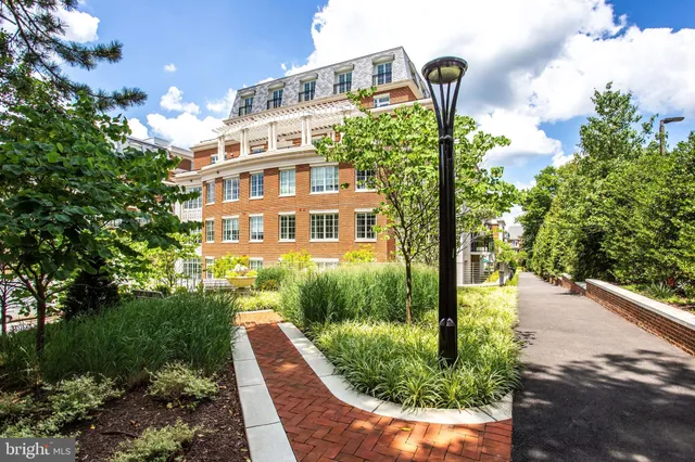 a view of entryway and hall with a front door