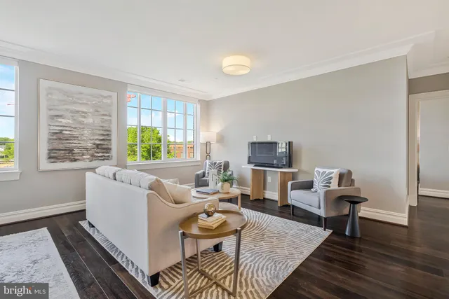 a dining room with wooden floor and window