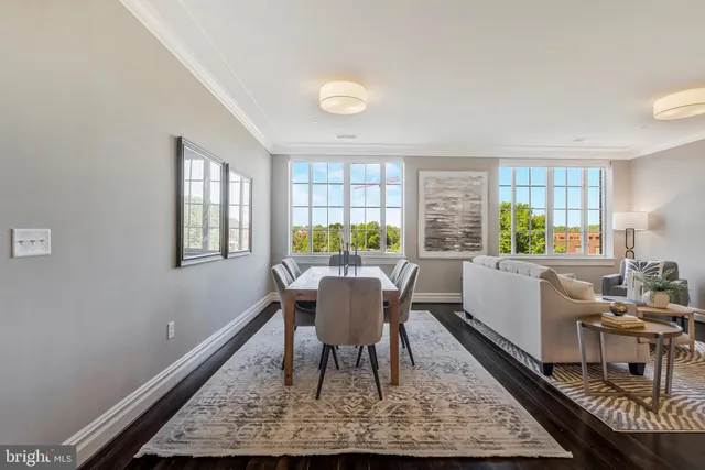 a view of a dining room with furniture and window