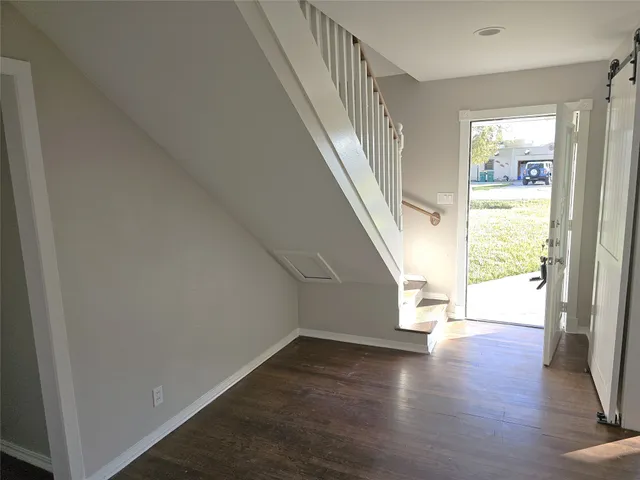 a view of entryway with wooden floor