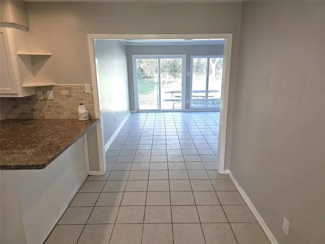 a view of an empty room and window