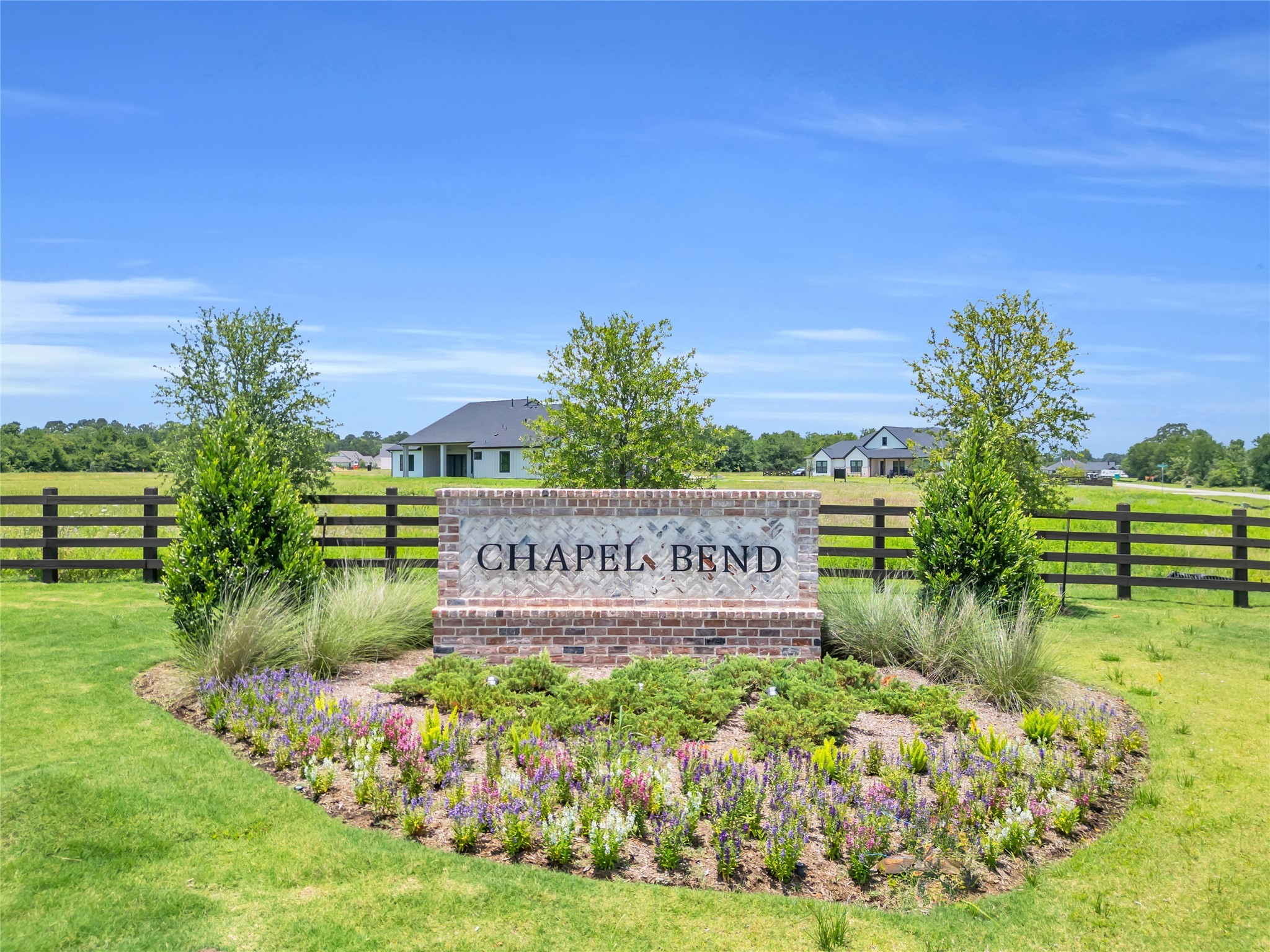 24951 Hopeview Way Montgomery, TX 77356 - Photo 6 of 8 a sign that is sitting in the grass near a tree
