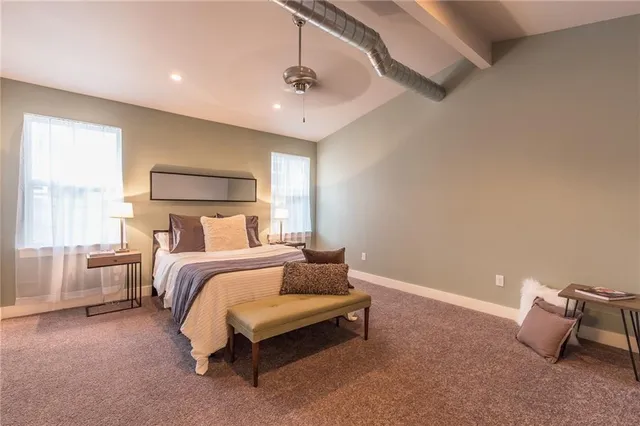 a bed room with a bed and a couch