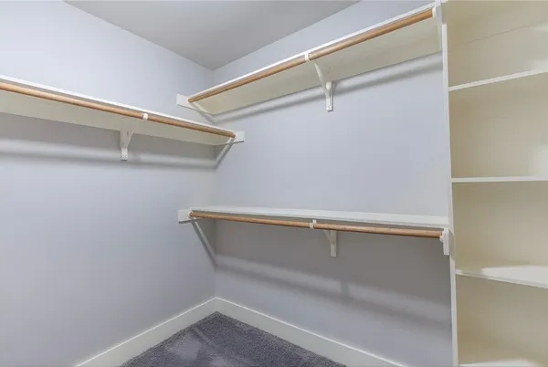 a view of an empty walk in closet