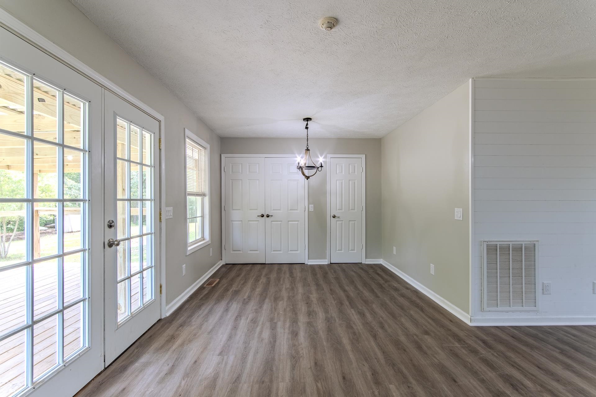 1633 Hardin Graveyard Road Adamsville, TN 38310 - Photo 11 of 33 wooden floor in an empty room with a window