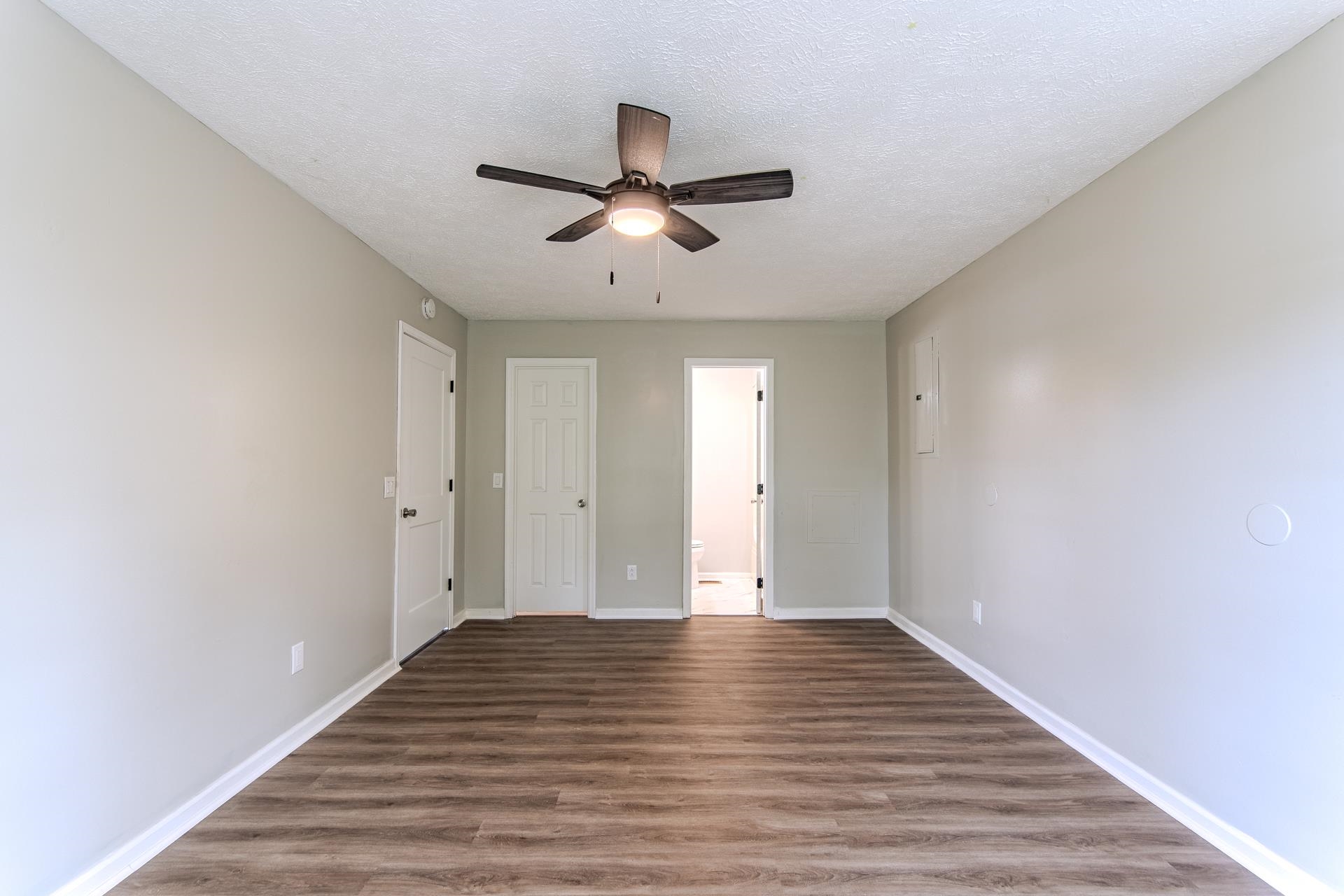 1633 Hardin Graveyard Road Adamsville, TN 38310 - Photo 17 of 33 a view of an empty room and wooden floor