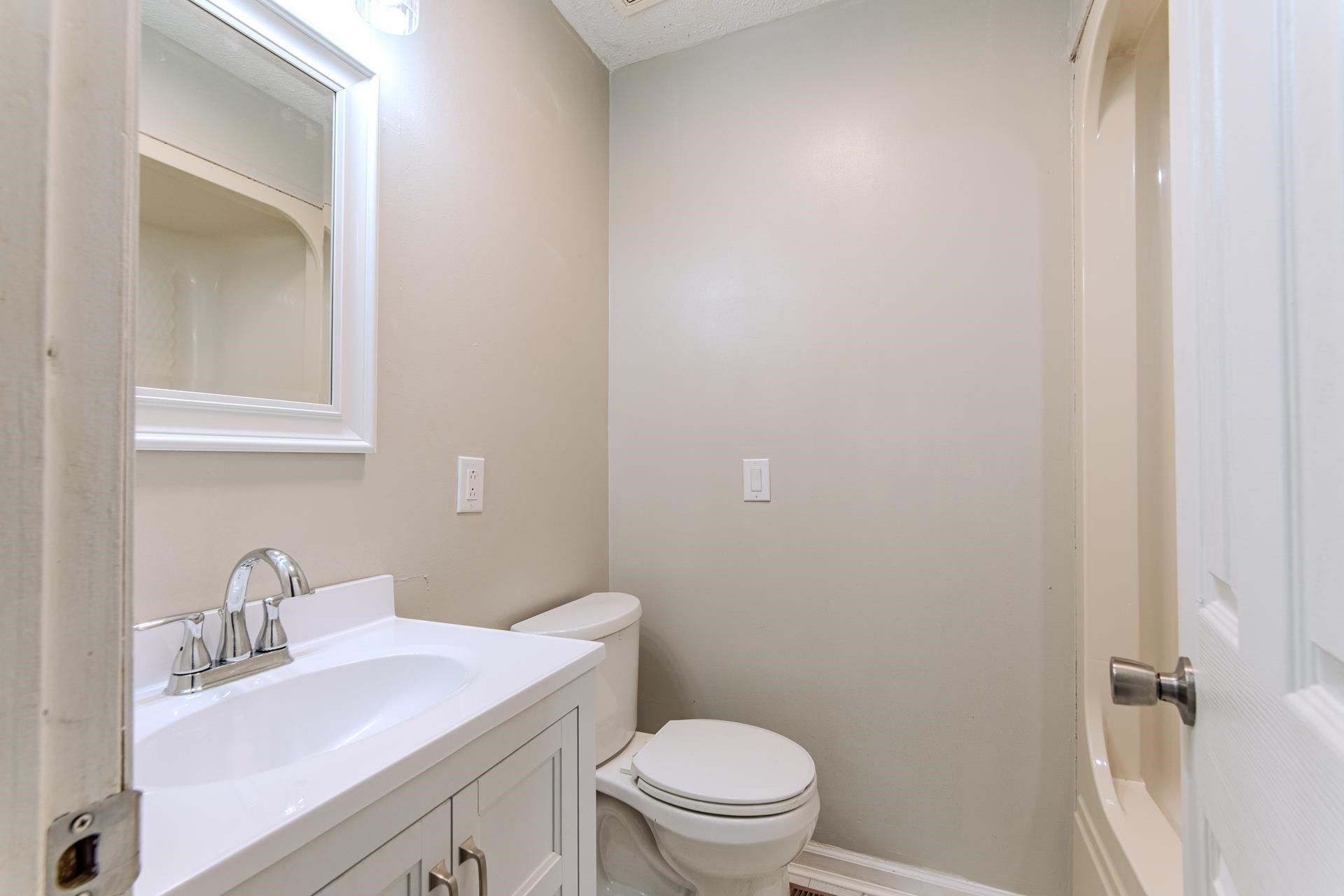 1633 Hardin Graveyard Road Adamsville, TN 38310 - Photo 18 of 33 a bathroom with a sink toilet and vanity