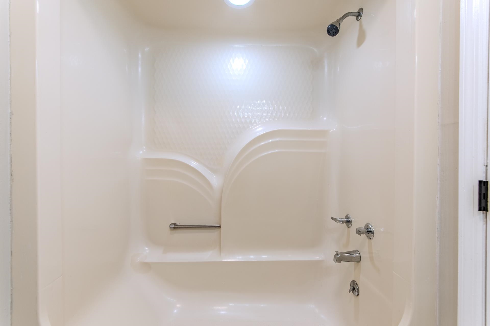 1633 Hardin Graveyard Road Adamsville, TN 38310 - Photo 19 of 33 a bathroom with a bathtub