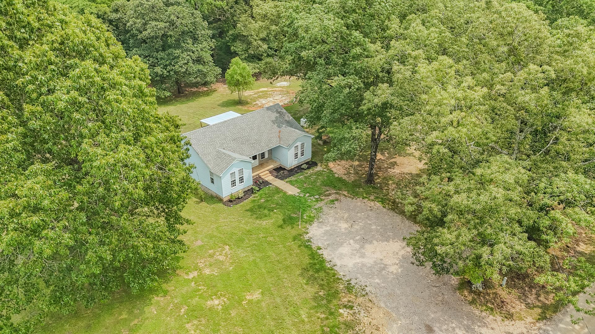 1633 Hardin Graveyard Road Adamsville, TN 38310 - Photo 2 of 33 a view of a yard with plants