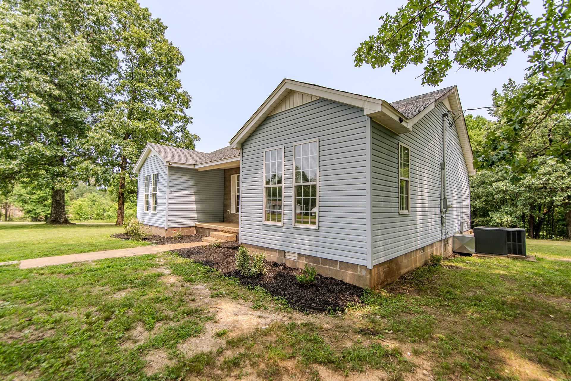 1633 Hardin Graveyard Road Adamsville, TN 38310 - Photo 30 of 33 a view of a house with a yard