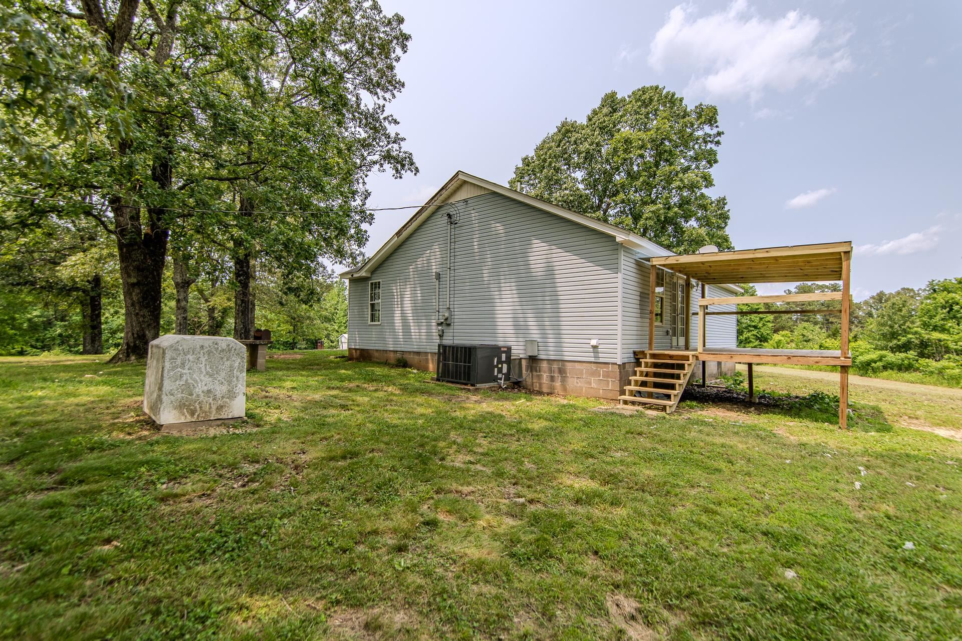 1633 Hardin Graveyard Road Adamsville, TN 38310 - Photo 33 of 33 a house view with a outdoor space
