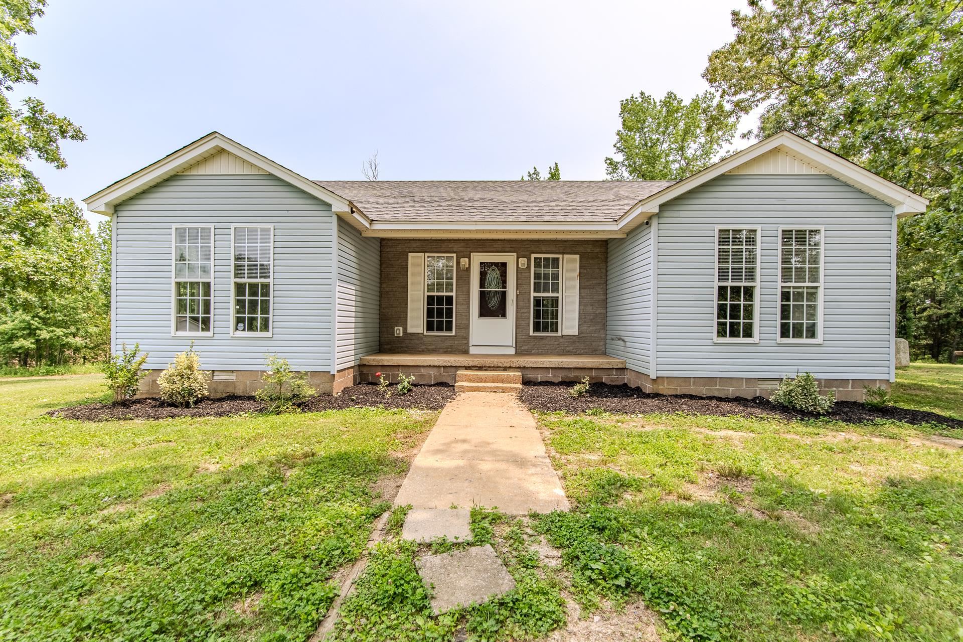 1633 Hardin Graveyard Road Adamsville, TN 38310 - Photo 4 of 33 a house view with a outdoor space