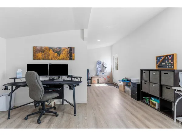 a workspace with furniture and wooden floor