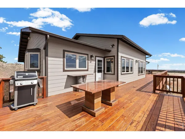 a view of a house with pool table and chairs