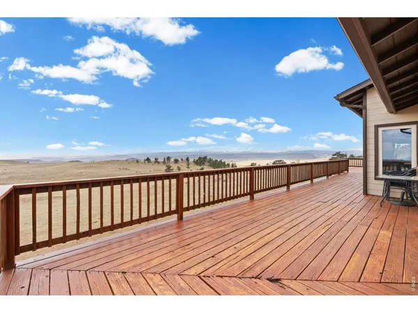 a view of balcony with wooden floor