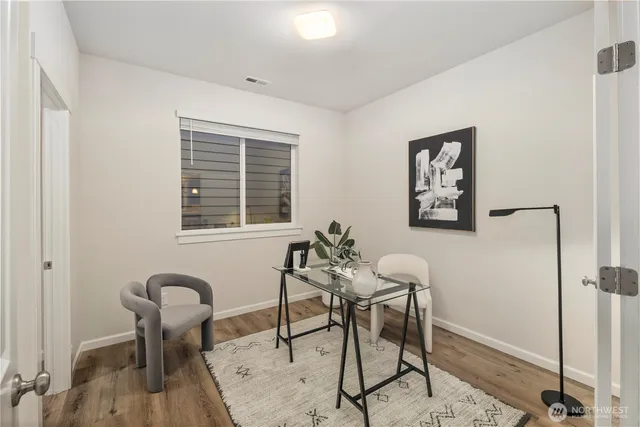 a workspace with furniture and window