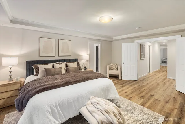 a bedroom with a bed and a view of bathroom