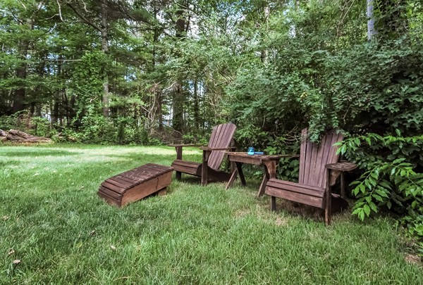 201 Converse Road Marion, MA 02738 - Photo 14 of 17 a view of a backyard with wooden fence and a bench