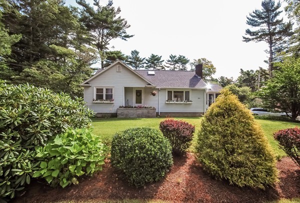 201 Converse Road Marion, MA 02738 - Photo 2 of 17 a front view of a house with garden