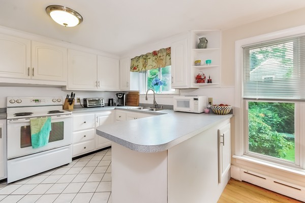 201 Converse Road Marion, MA 02738 - Photo 5 of 17 a kitchen with a sink stove and cabinets