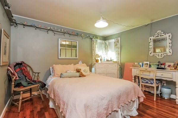 201 Converse Road Marion, MA 02738 - Photo 9 of 17 a bedroom with a bed and a chair