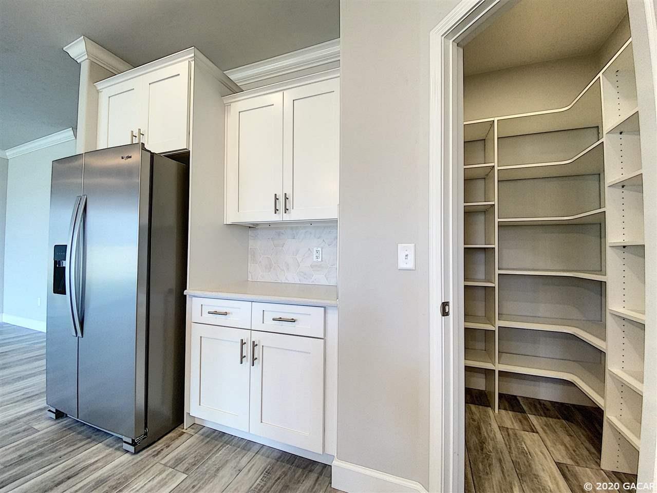 1664 Southwest 71st Circle Gainesville, FL 32607 - Photo 12 of 30 Fridge and wood closet system in pantry are not included--ask about pricing!