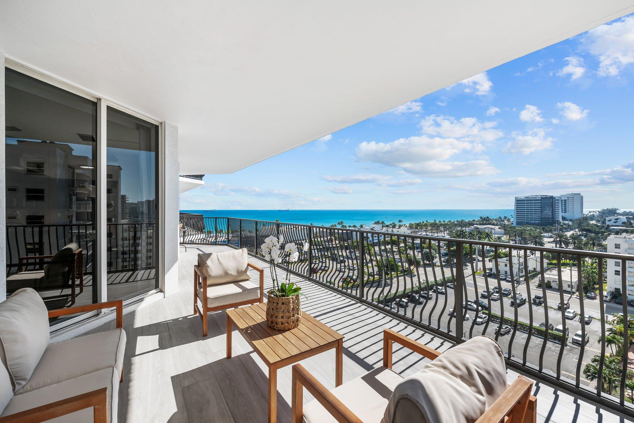 100 South Birch Road, Unit 1004 Fort Lauderdale, FL 33316 - Photo 1 of 39 a balcony with furniture and city view