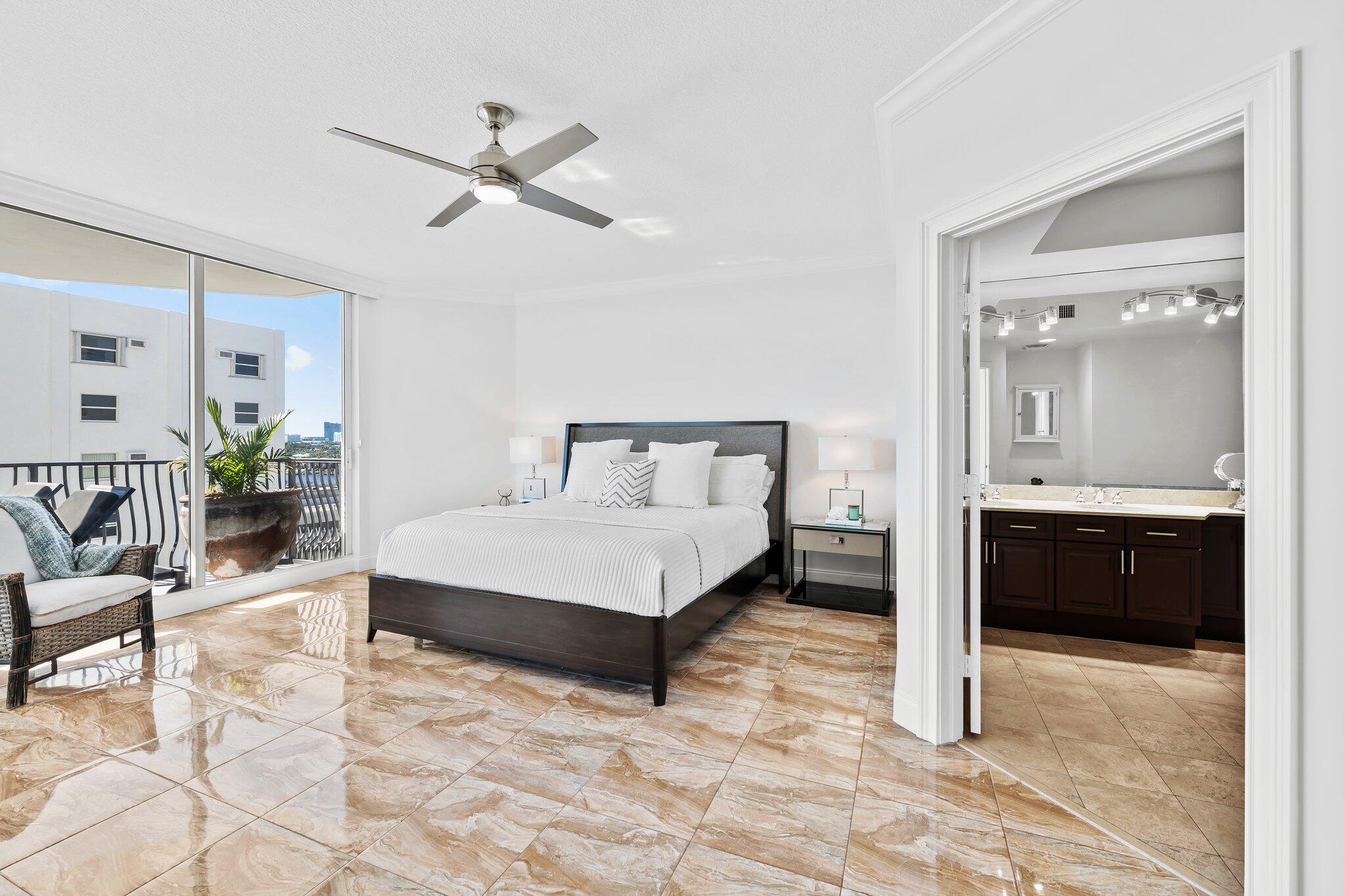 100 South Birch Road, Unit 1004 Fort Lauderdale, FL 33316 - Photo 15 of 39 a spacious bedroom with a bed and ceiling fan