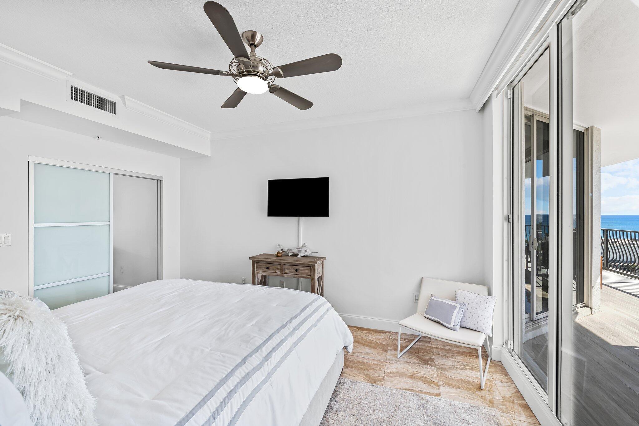 100 South Birch Road, Unit 1004 Fort Lauderdale, FL 33316 - Photo 20 of 39 a bedroom with a bed and a flat screen tv