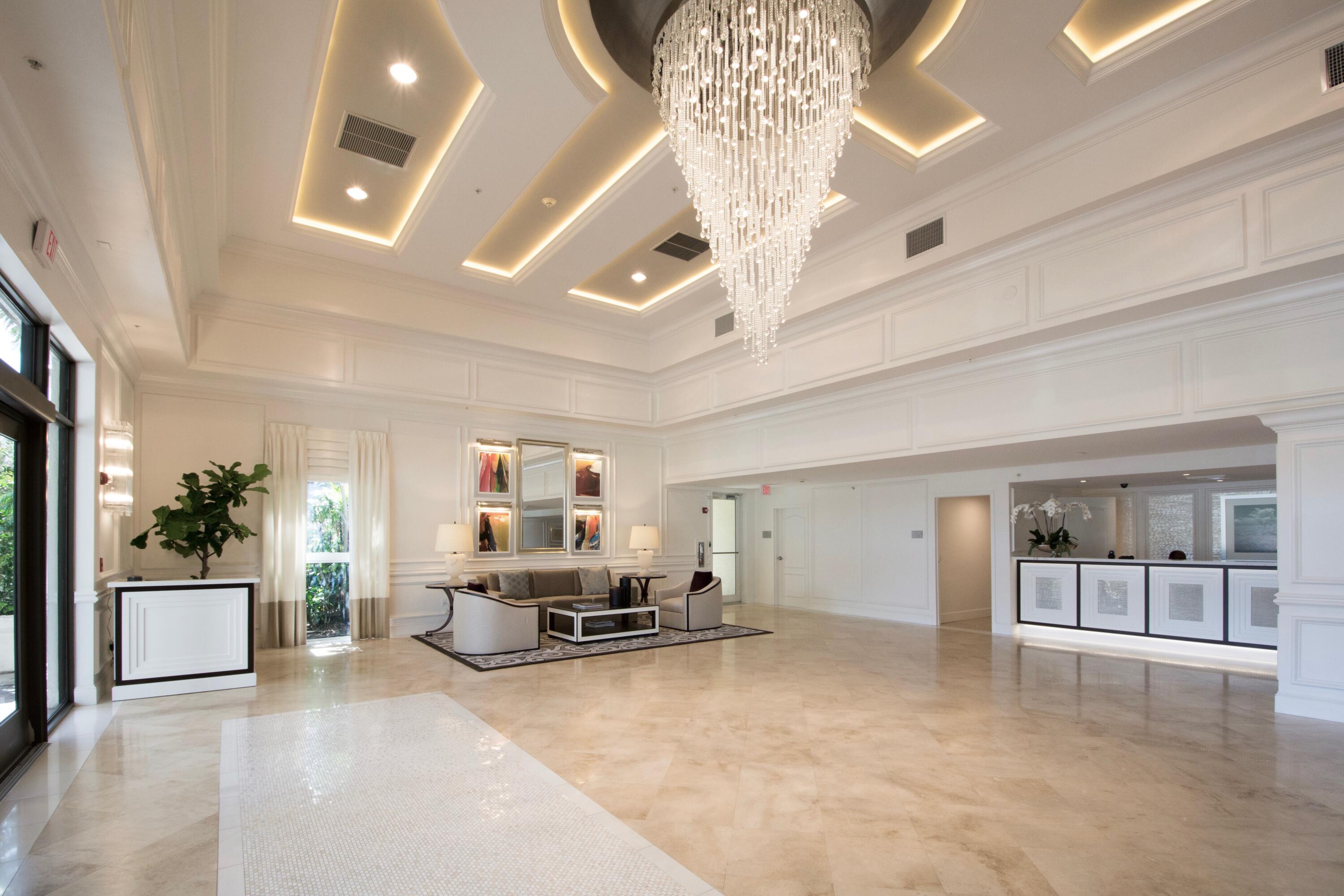 100 South Birch Road, Unit 1004 Fort Lauderdale, FL 33316 - Photo 30 of 39 a living room with furniture and a chandelier