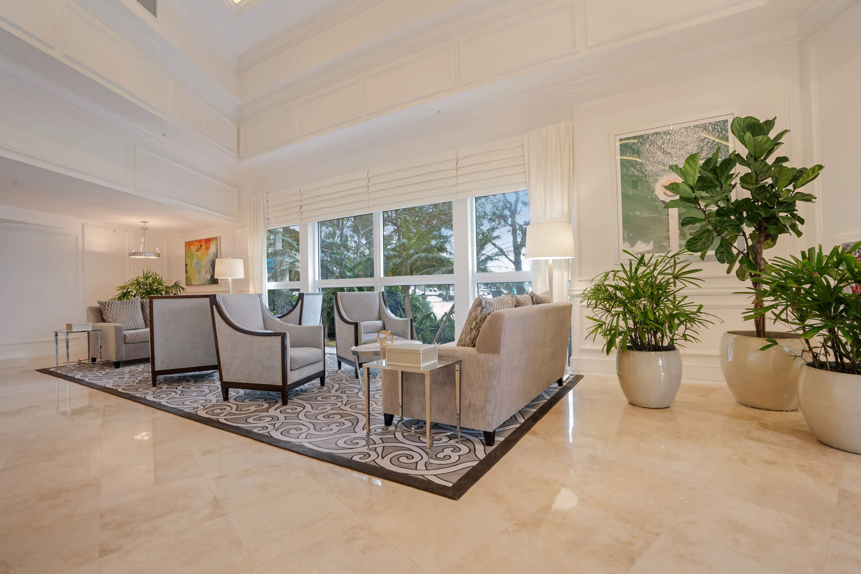 100 South Birch Road, Unit 1004 Fort Lauderdale, FL 33316 - Photo 34 of 39 a living room with furniture and a potted plant