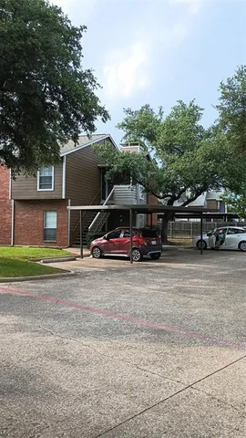 a view of a car parked in front of a house