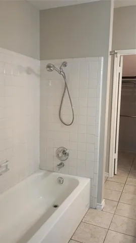 a bathroom with a bath tub and a shower
