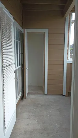 a view of front door and yard