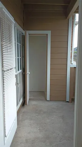 a view of front door and yard