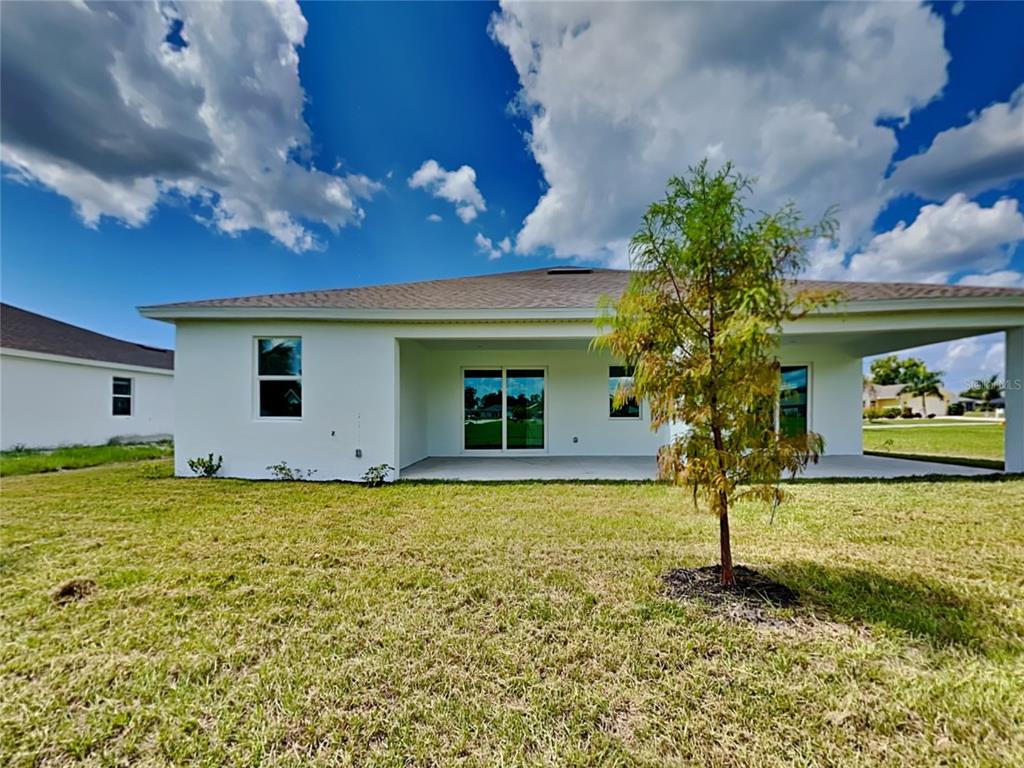 16234 Maya Circle Punta Gorda, FL 33955 - Photo 19 of 19 a view of a house with a backyard